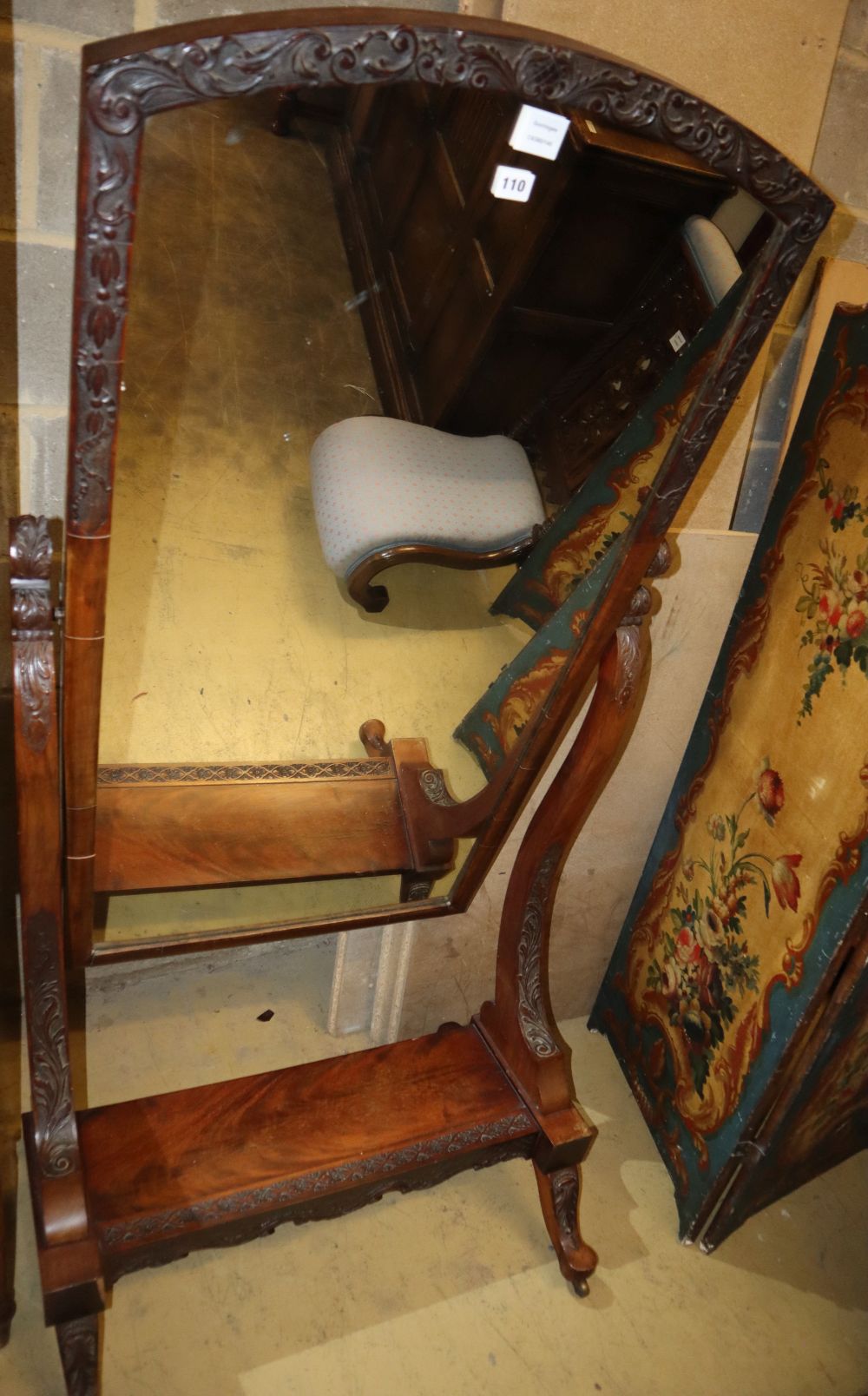 A Victorian carved mahogany cheval mirror, on acanthus tapered legs and castors, 80 x 164cm